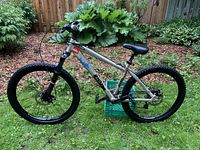 Full side view of bike showing frame, wheels, saddle, handlebars