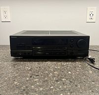 Front view of Technics AV Control Stereo Receiver SA-GX470 showing control panel and power cord.