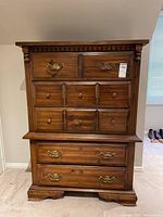 Front view of Kroehler 5-drawer highboy chest with brass and wooden pull handles, minor surface wear visible.