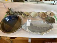 Overview of whole pottery lot including fish plate, carafe with cups, bowls, and pie plates.