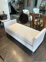 Front three-quarter view of the ottoman bench in room