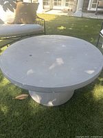 Top-down view of round tabletop showing surface condition