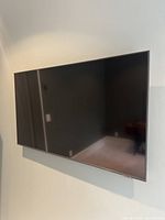 43-inch Samsung flat panel television mounted on wall