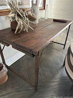Overall angled view of wooden top console table in room setting