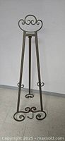Full view of the metal decorative easel showing its overall size and design against a plain background.