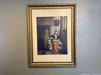 Framed artwork hanging on a wall showing the full framed print with visible matting and frame details.