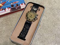 Watch in original tin case with insert