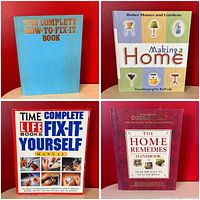 Four hardcover books stacked and arranged to show titles and covers. The Complete How-to-Fix It Book (blue cover), Better Homes and Gardens Making a Home (beige/green cover), Time Life Complete Fix-It Yourself Manual (white with images), and The Home Remedies Handbook (red cover).