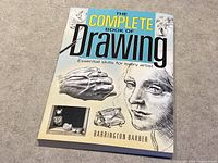 Front cover of 'The Complete Book of Drawing' showing detailed pencil drawings and title text.