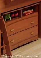 Front view of the wooden two-drawer chest with open shelf on top and decorative square handles, showing the Morgan Cherry finish.