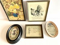 Overview of five vintage framed pictures on white background, shows embroidered silhouette, prayer verse, two poems, and floral oil painting.