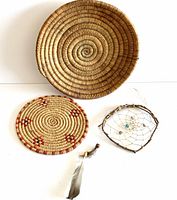 Full lot showing the three items: large coiled basket, smaller dyed grass trivet, and the dream catcher with feathers.