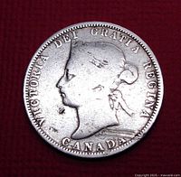 Obverse side of 1882 Queen Victoria Canadian 25 cent silver coin showing profile of Queen Victoria with inscription.