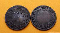 Two bronze Queen Victoria Canada large 1 cent coins, reverse side showing 'ONE CENT 1895' surrounded by maple leaf wreath on yellow background.