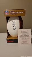 Photo of the Wilson NFL Autograph Game Ball signed by Jerry Rice in packaging along with the Certificate of Authenticity.