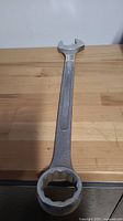 Full view of the large combination wrench showing both open and box ends.