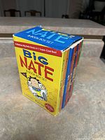 Box set of 8 Big Nate books neatly placed in their box with visible cover and spines.
