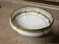 Top view showing interior gold trim and vine pattern within the porcelain bowl