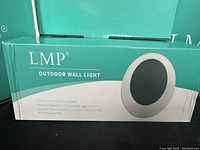 Close-up of one LMP Outdoor Wall Light box with design and usage details