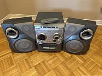 Full view of Philips stereo system with main unit and two speakers.