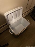 Open view of Rubbermaid large ice chest cooler showing interior and hinge lid