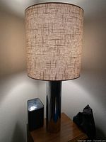 Lamp turned on showing light diffusion and lampshade texture