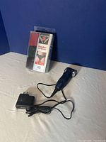 Used Panasonic Electric Razor ES8243 with charger and unopened men's underwear in packaging.