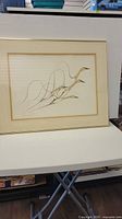 Full view of framed Benjamin Chee Chee print depicting geese flying with smooth line work.