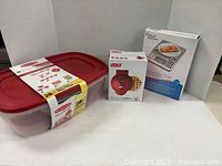 Rubbermaid 28-piece container set, Weight Watchers food scale, Dash mini waffle maker in original packaging