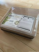 Packaged beige/sand Bamboo Hotel Luxury Comfort queen size sheet set including fitted sheet, flat sheet, and two pillowcases with 2800 thread count label visible.