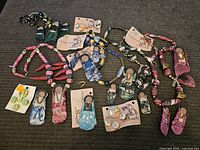 Photo showing all Cherokee Dreams necklaces and earrings spread to display items and colors