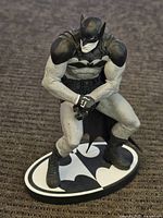 Close-up photo of Batman figure showing muscular pose and detailed paintwork
