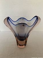 Front view of the Josef Hospodka colored glass vase showing its pink base and soft blue-tinted rim with elegant folds.