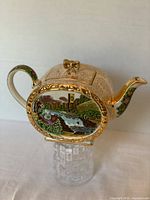 Side profile of the rectangular teapot showing the Abbey Falls scene and gold gilt trim