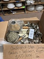Box of Gorham silverplate candlestick holders, shades, and liners in as-is condition