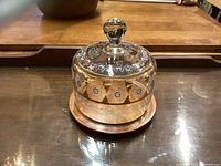 Clear glass cheese dome with etched floral and geometric patterns and knob handle on base