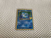 Front of Early Pokémon Blastoise 100 HP card showing holographic image and card details.