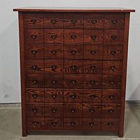 Front view of entire cabinet showing drawer layout and finish