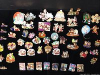 Full spread of approximately 40–45 Chip and Dale enamel pins on black background, bottom row includes travel-themed pins