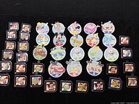 Overview of all 42 pins laid out on black background showing circular and square shapes