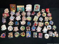 Overall top-down view of entire collection of pins on black background
