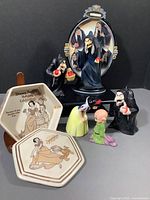 Seven Disney Snow White themed collectibles grouped including salt and pepper shakers, figurines, and trinket box.