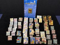 Full spread of all pins on black background.