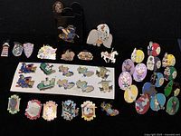 Full layout of 40 assorted Disney Dumbo and related character trading pins including limited editions and Hidden Mickey pins.