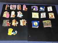 Overall lot displayed on two black boards: left board with door pins, right board with book pins