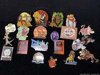 Overview of all 21 Lion King themed trading pins arranged on black background.