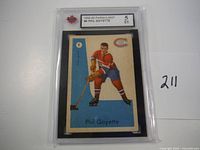 Front of the 1959-60 Parkhurst Phil Goyette hockey card graded EX 5 by PSA with player in Canadiens uniform posed with hockey stick.