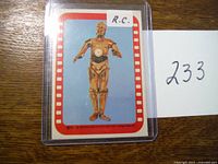 Front of the 1977 Series 3 C3PO trading card showing C3PO standing centered with a red and white border