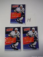 Three sealed 2007-08 Upper Deck Victory hockey card packs front view showing the player's image and promotional text.
