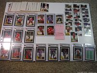 Full display of loose and slabbed 1987-88 O-Pee-Chee hockey cards including graded rookie cards and loose commons.